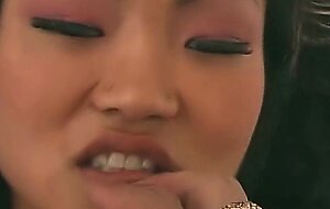 The kinky Lucy Lee stretches her Asian holes with sex toys before intense anal begins.