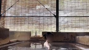 japanese girl bathing in a mixed outdoor bath at a hot spring inn