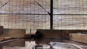 japanese girl bathing in a mixed outdoor bath at a hot spring inn