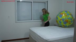 Alla happily jumps on a large rare beach ball and does fitness