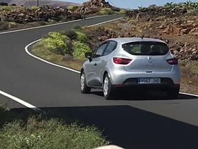 Naked on a bicycle through a town