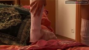 Hot girl moans in pleasure as she thrusts her pussy with a huge dildo