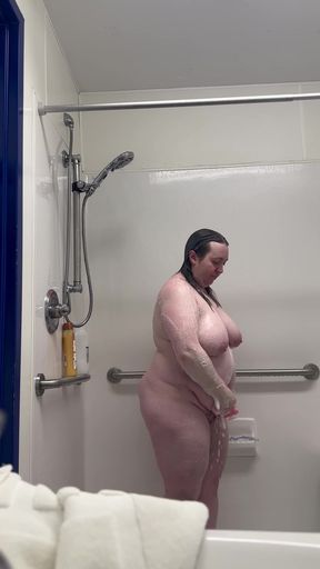 Wifey taking a shower at the laundromat. She lathers up her tits, ass