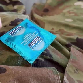 Jerking off in uniform into a condom already full of the cum of buddies