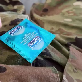 Jerking off in uniform into a condom already full of the cum of buddies