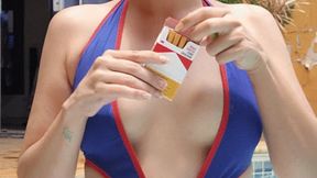 Naughty Smoking cork cigarette in a swimsuit by the pool