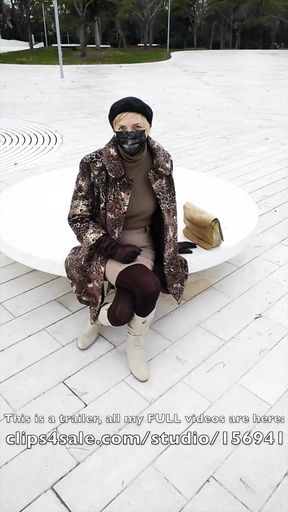 Crossed legs orgasm sitting on a bench in a park