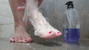 Washing my feet with lots of bubbles.