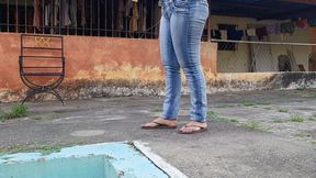 Woman desperate for chewing gum that sticks to her flip-flops while she tramples on them (3)