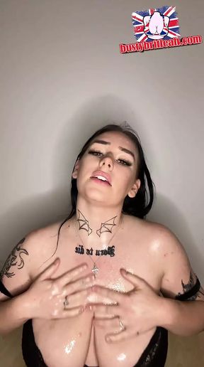 British teen dirty talks whilst running her tits in massage oil