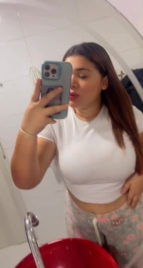 Woman in white top taking selfie