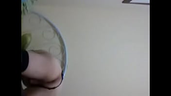 Crossdresser playing with dildo