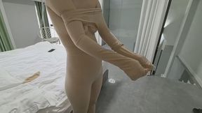 ZENTAI girl dangling with electric shock pads attached