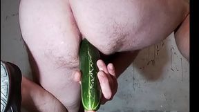 GT pushing long cucumber in ass