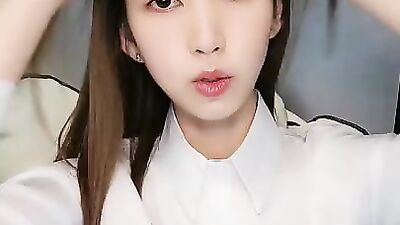 Beautiful Asian teen is giving JOI while being solo and dressed