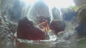 Sultry tourist flashes her perfect ass at waterfall in jungle