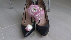 She crushed beautiful flowers with black leather shoes d