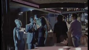 2 Sluts Share an Italian Cock in a Nightclub Among the People