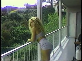 Blonde babe slaps slim brunette's ass on the sofa during catfight