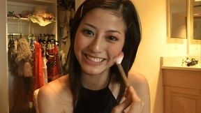 Pretty Japanese brunette Yumi Sugimoto puts on her makeup