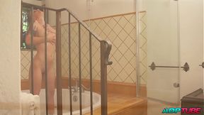 Milf fucking a blonde with a tremendous ass in the bathroom