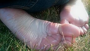 Redhead teen 18+ Is With Her Knees On The Grass Exposing Her Perfect Oily Feet