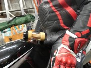 Leather biker milked on his motorcycle