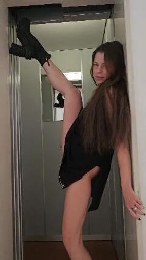 Sensual and horny brunette make sensual streap in the elevator and go all naked