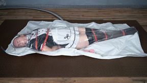 Bondage with red maid straps with vibro in vacuum bag