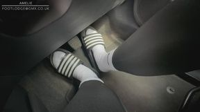 Driving in sliders and Nike socks