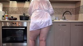 A plump wife prepares breakfast, while a home camera watches. A big ass in white panties under a short robe. PAWG.