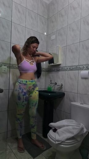 Maid changing clothes in the bathroom.   Clip 2