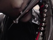 Sucking and spitting heels and dildo in silicone mask and black nylon encasement