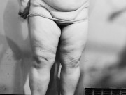 Chubby MILF strips naked in the basement, showing off her big ass and curvy figure