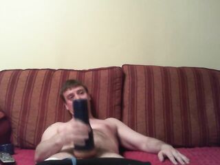 Watching porn playing with a blue fleshlight