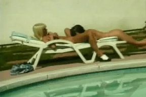 Tempting babes sharing big dildo poolside