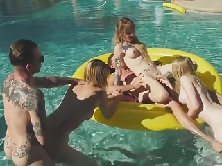 Shemale babes go hardcore with guys in a pool orgy