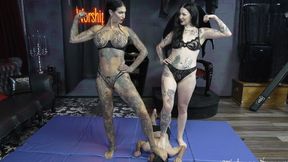 Two amazons wrestle a tiny man into submission