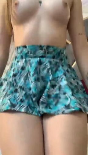 Underneath my skirt there are no panties; my tits jiggle as I lift my skirt to touch my wet pussy and scream with pleasure. 😈🍑💦