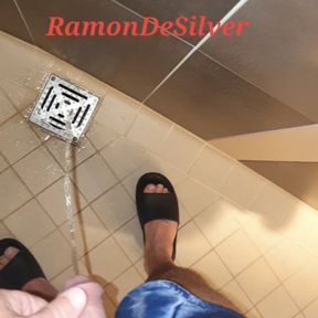 Master Ramon pisses next to the urinal in sexy blue satin shorts, lick it on slave