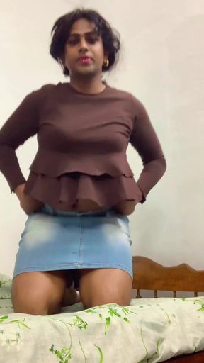 Cute girl in ruffled shirt and denim skirt