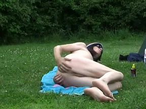 Naked sunbathing at a public campground by Mark Heffron