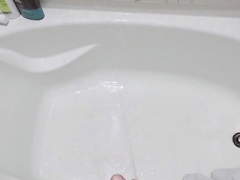 Soaking the bathtub with pee