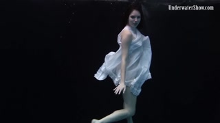 Redhead beauty in the white dress