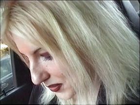 Big boobed blonde gives blowjob in car
