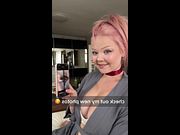 Pink hair tied up as she grins holding her phone 😳