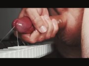 Stunning young cock pissing and jerking on the piano