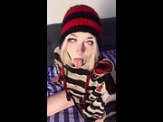 Blonde in beanie sticks tongue out and teases with her eyes 😈