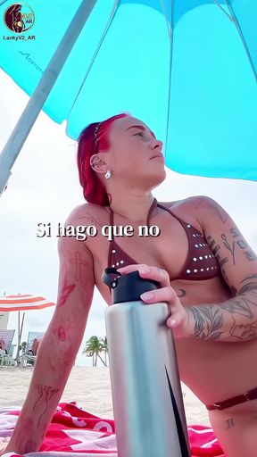 Latina in a bikini shows off her body on the beach