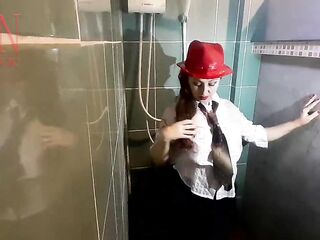 A hottie in raiment beneath the shower. Juicy pants, juicy trousers, juicy shirt. Full